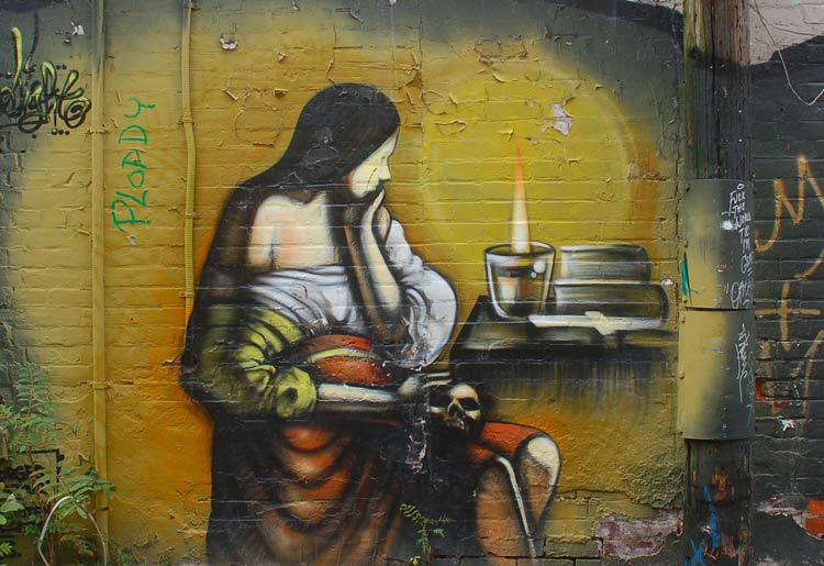 graffiti picture of a pensive woman watching a candle burn