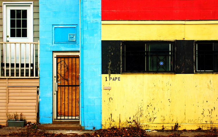 front door of 1 Pape Ave., a colourful house in blue, yellow and red