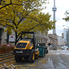 construction on a downtown street, with the CN tower in the background.  