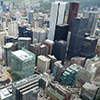 view from the CN tower, looking down over the city towards the north.  Lots of tall buildings. 