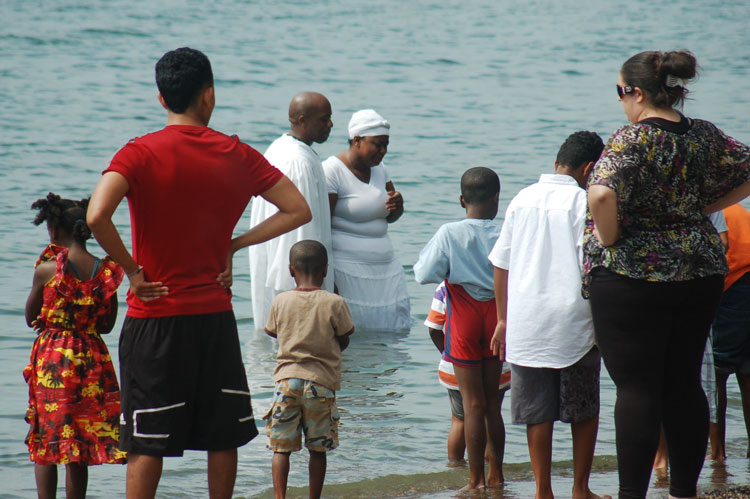 Church baptism by dunking in the lake at the beach. 