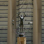 the sculpture in front of Union Station with construction in front of it.  Union Station is covered in protective plastic 
