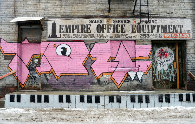 a raised area behind a building has been painted to look like a piano keyboard.