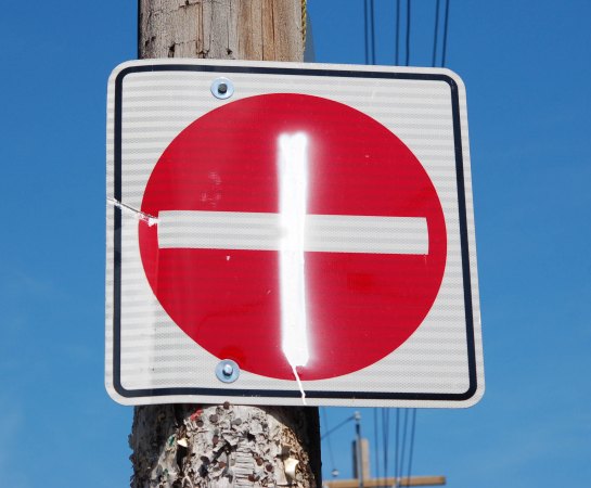 a do not enter sign with an extra white line added to it so that it now looks like a plus sign