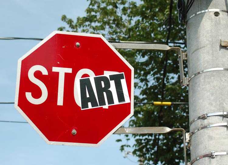 a stop sign that has had the word art added to it. Now the sign says start
