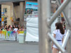 woman wearing white clothes in the enclosed area where the paint party will be held.  