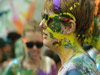 close up of a woman with a lot of paint on her face 