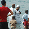 Church baptism by dunking in the lake at the beach. 