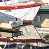 boats moored at Harbourfront and their reflections in the water 