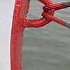 a red ring and wire cables on a boat 