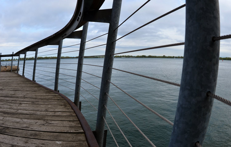  Wire railing between Lake Ontario and a walkway along the shore